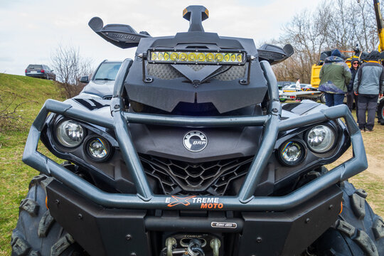 Afipsip, Russia - October 31, 2020: BRP Can Am Outlander logo on yellow black quad bike at Mud Racing contest. ATV SSV motobike competitions are popular extreme sport and outdoor activity.