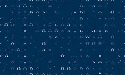 Seamless background pattern of evenly spaced white headphones symbols of different sizes and opacity. Vector illustration on dark blue background with stars