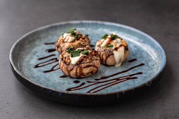 Stuffed mushroom caps with cream cheese, breadcrumbs and parmesan