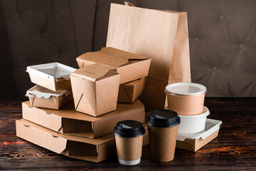 Eco craft paper tableware. Paper cups, dishes, bag, fast food containers, box for delivery food on...