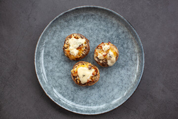 Stuffed mushroom caps with cream cheese, breadcrumbs and parmesan