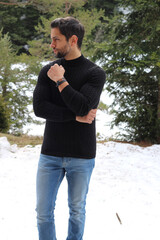 Handsome fashion model posing outdoor . Winter fashion