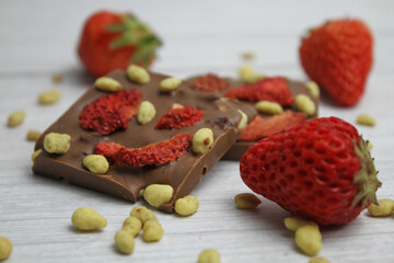 Hand made chocolate with freeze-dried strawberry and pine nuts
