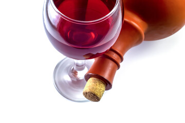 Glass and barrel with red wine on a white background.