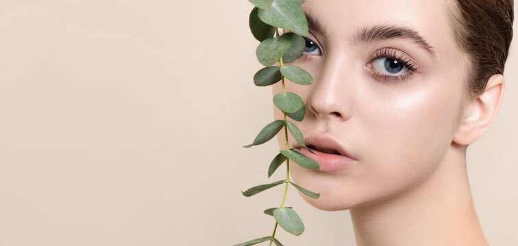 Portrait of beauty model with natural nude makeup with eucalyptu