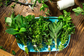 Collection of Fresh Aromatic Herbs on Wooden Table. Overhead View