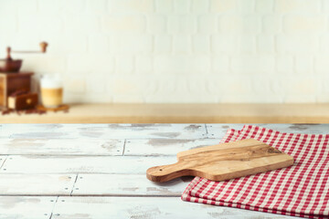 Empty wooden  table with cutting board over kitchen shelf background.  Interior mock up for design...