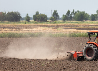 Ploughing a field with tractor. land preparation for agricultural field.