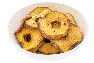 dried apple rings in a white bowl close-up.isolated food products