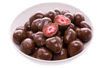strawberries in dark chocolate.candies. in a white dish close-up.isolated food products