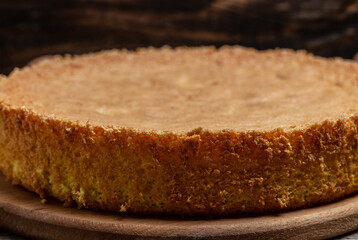 Homemade sponge cake on wooden table, Bakery background concept