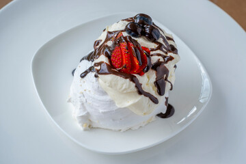 Delicious Pavlova with fresh berries and chocolate