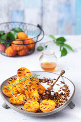 Grilled apricots with Greek yogurt, granola and honey. Summer breakfast