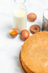 Piece of delicious fresh homemade sponge cake or chiffon cake on light table, vertical image