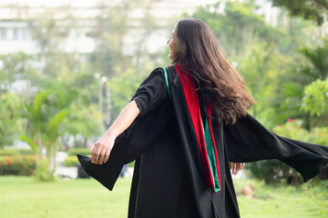 Back of college student in commencement day, concept of successful education, happy graduation,...