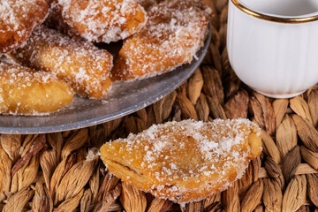 Fried sweet (borrachuelo) stuffed with angel hair, a typical Spanish dessert from Andalusia. Ideal for Christmas and Easter. Horizontal shot and selective focus.