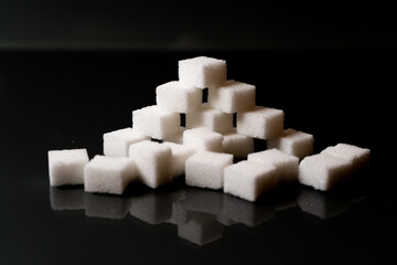 Sugar cubes in different arrangements and colored light. Bavaria Germany . Arrow, Pile, Cube, Square,