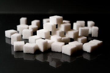 Sugar cubes in different arrangements and colored light. Bavaria Germany . Arrow, Pile, Cube, Square,