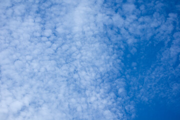 Fototapeta na wymiar Blue sky scenery with many small clouds, clear sky.