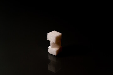 Sugar cubes in different arrangements and colored light. Bavaria Germany . Arrow, Pile, Cube, Square,