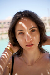 beautiful girl on the beach, on the sea, posing on the beach, rest on the sea. High quality photo