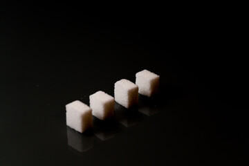 Sugar cubes in different arrangements and colored light. Bavaria Germany . Arrow, Pile, Cube, Square,