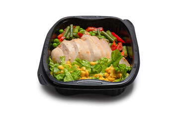 Ready food in a container. Stewed chicken, stewed vegetables.