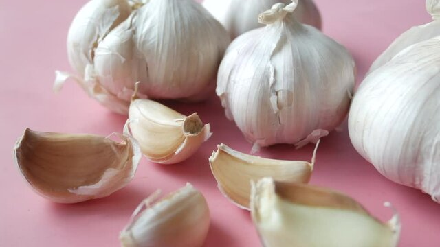 close up pf garlic on pink background,