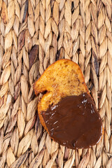 Fried bread with milk, egg, sugar, cinnamon and chocolate (Torrijas). Typical Spanish Easter sweet. Vertical photography and selective focus