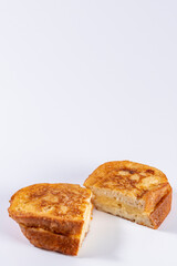 Fried bread with milk, egg, sugar, cinnamon and filled with cream (Torrijas). Typical Spanish Easter sweet. Vertical photography and selective focus