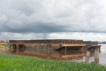 old barge rusty and stranded in the harbor