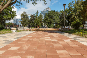 Using colored concrete slabs for paving the sidewalk.