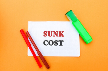 Note with words Sunk cost - retrospective cost and markers. Costs that cannot be recovered. Business and finance concept
