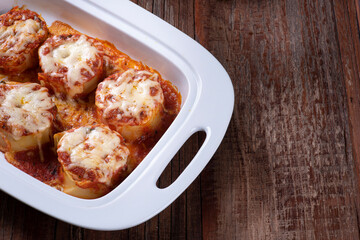 .Rondelli, a traditional pasta dish from Italian cuisine. With tomato sauce and parmesan cheese. Copy space