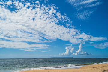 Ni'ihau island off the coast of Kauai, Hawaii and blue sky and clouds