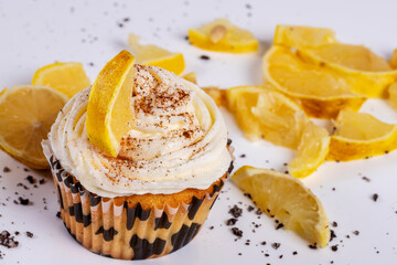upcake of cinnamon and lemon cream sponge cake on white background. Horizontal shot