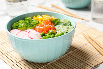 Delicious salad with salmon and vegetables on table, closeup