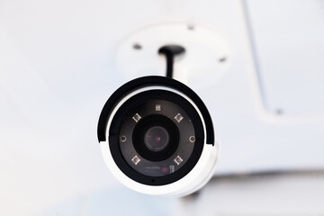 CCTV camera on the hull of an expensive motor yacht. CCTV camera white on a white body.