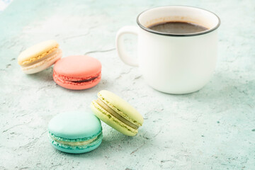 colorful macaroons and coffee on a table
