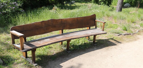 a nice brown garden bench