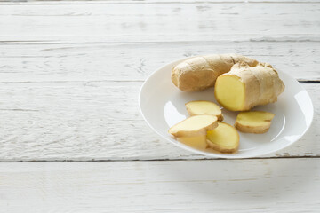 Empty space for text. Ginger on a white-board table