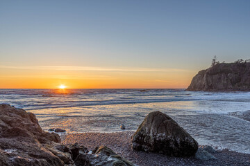 Sunset along the rugged coast of Washington on Ruby Beach in Olympic National Park.