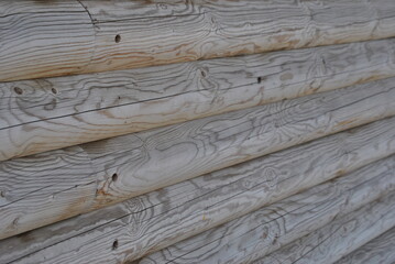 Fototapeta premium zdjęcie tekstury przedstawiające bale drewna ułożone poziomo