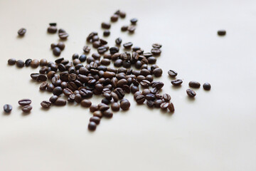 coffee beans scattered in the morning on a white table