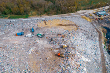 Truck brought household waste landfill, no recycling and separation, aerial top view landfill...