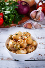 Homemade mini pickled potatoes in a white bowl