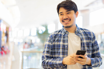 close up candid shot on young attractive middle eastern man looking while smile with happy feeling...