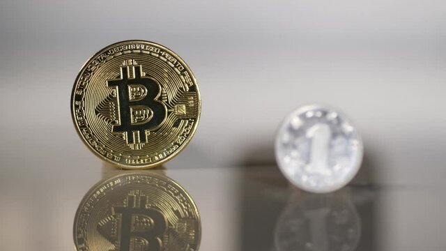 Chinese yuan coin with Bitcoin in the background. Focus shifts from yuan to Bitcoin.  