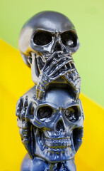 The statue of skulls no evil hear or see in grey colors