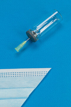 Blue background with surgical mask